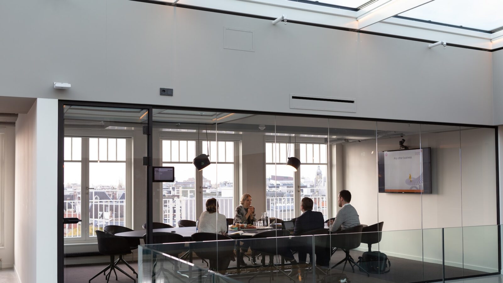 Meeting in corporate office with multiple employees to reflect mass termination