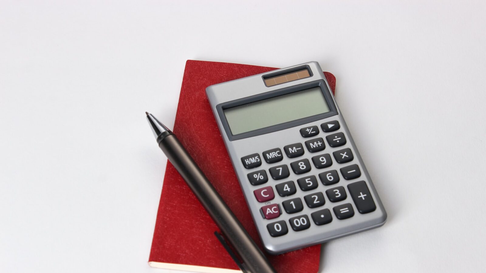calculator and pen indicating tax season