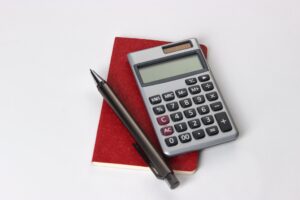 calculator and pen indicating tax season