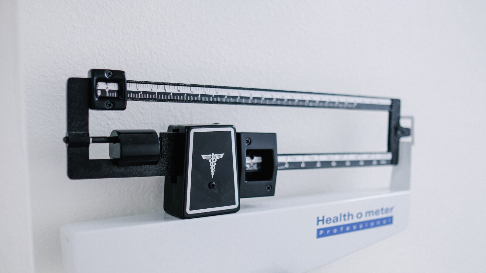 doctor's scale representing obesity