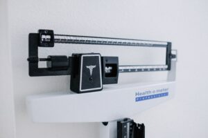 doctor's scale representing obesity