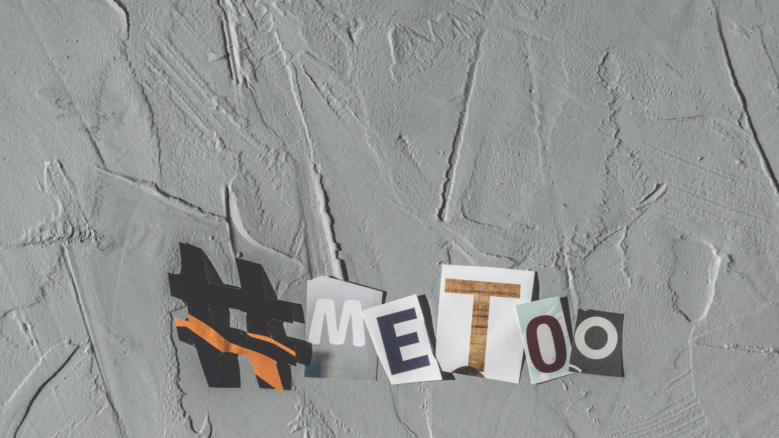 the phrase # Me Too spelled out in cut out letters