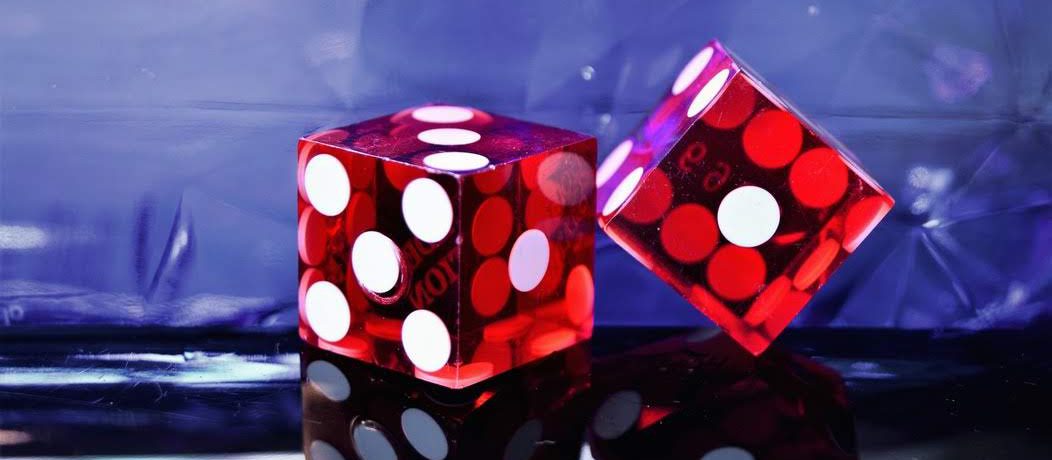 red plastic dice representing a casino as employer