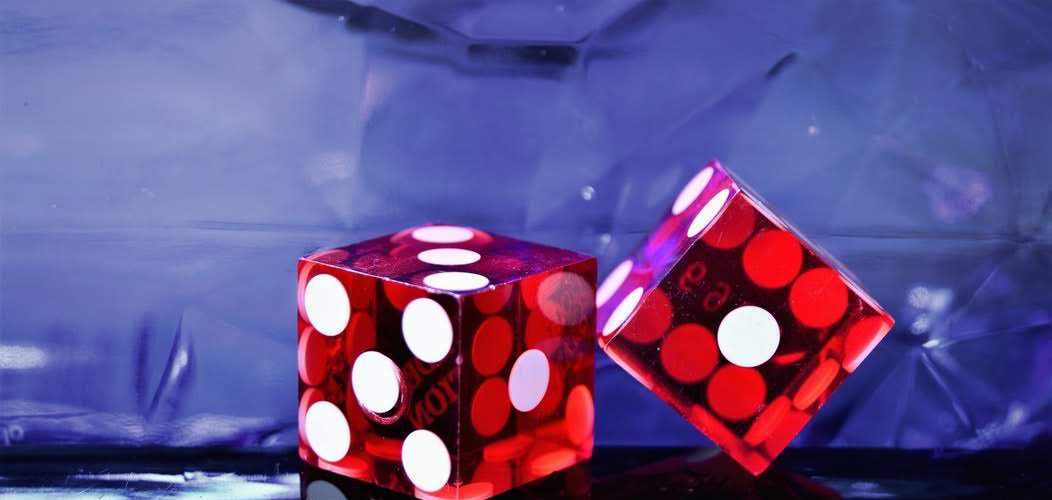 red plastic dice representing a casino as employer