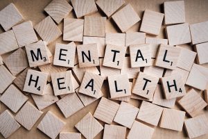 scrabble tiles spelling out 'mental health'