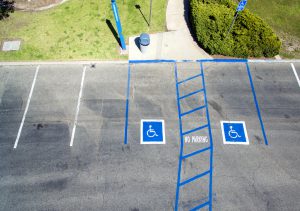 Two accessible parking spots in a parking lot, representing an employer's duty to accommodate