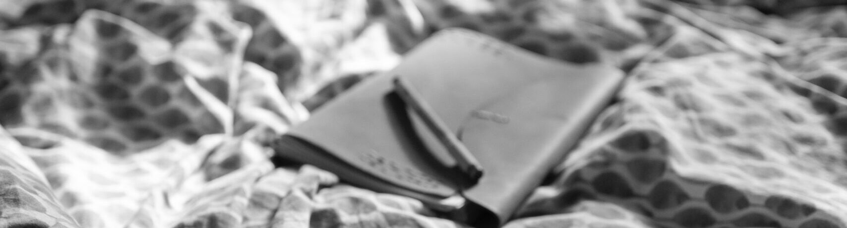 notepad on bed