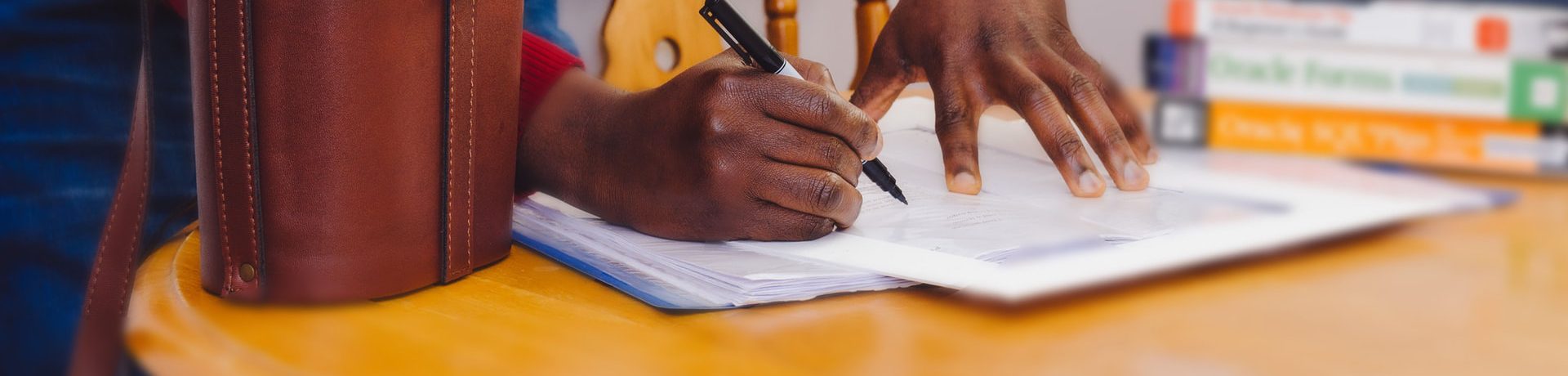 A man signing a contract