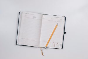 An open datebook representing the coming deadline for the expiration of layoff protections for employers