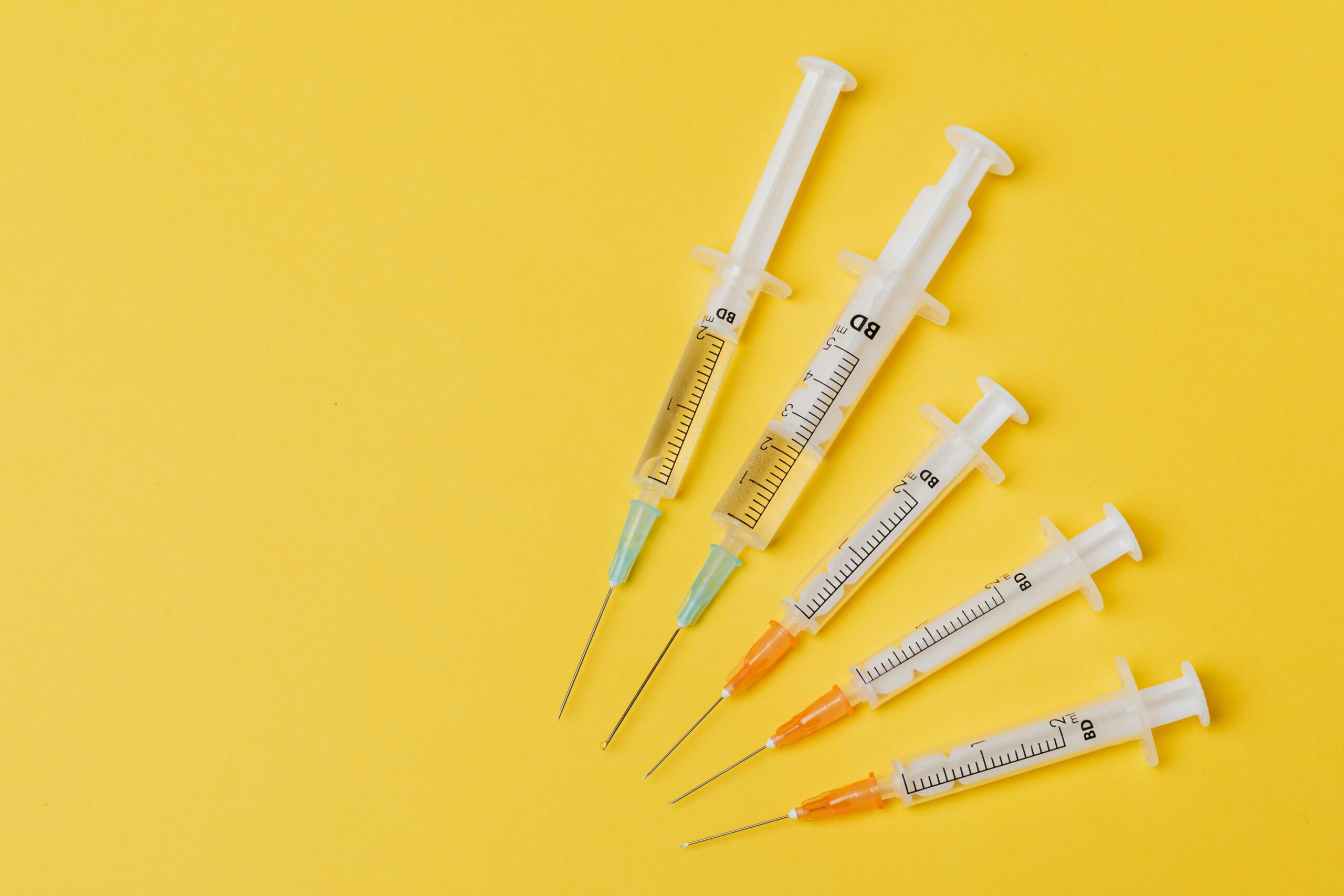 Vaccine needles representing vaccine exemptions in unionized workplaces